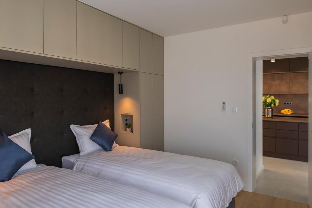 Postel nebo postele na pokoji v ubytování Villa Magna luxury apartments