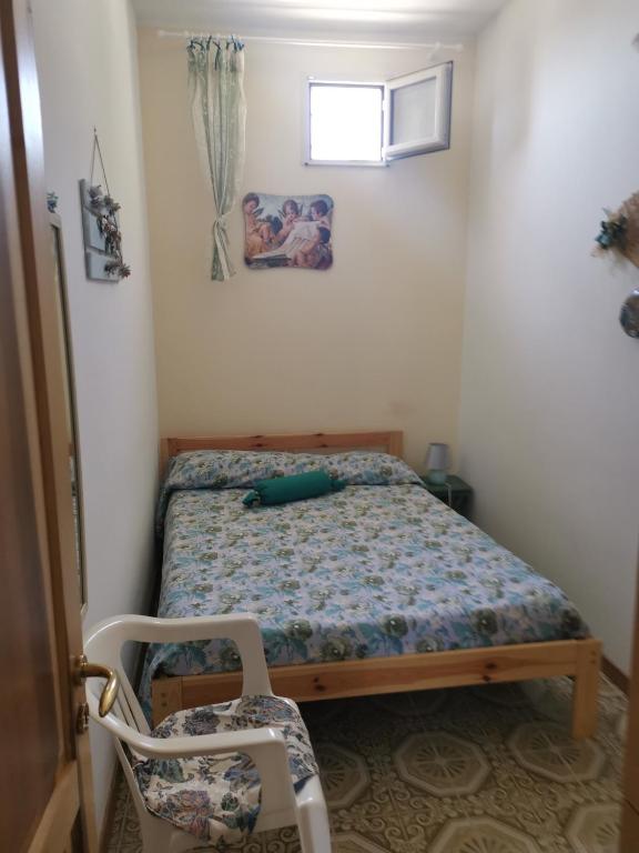 Postel nebo postele na pokoji v ubytování Carrube House