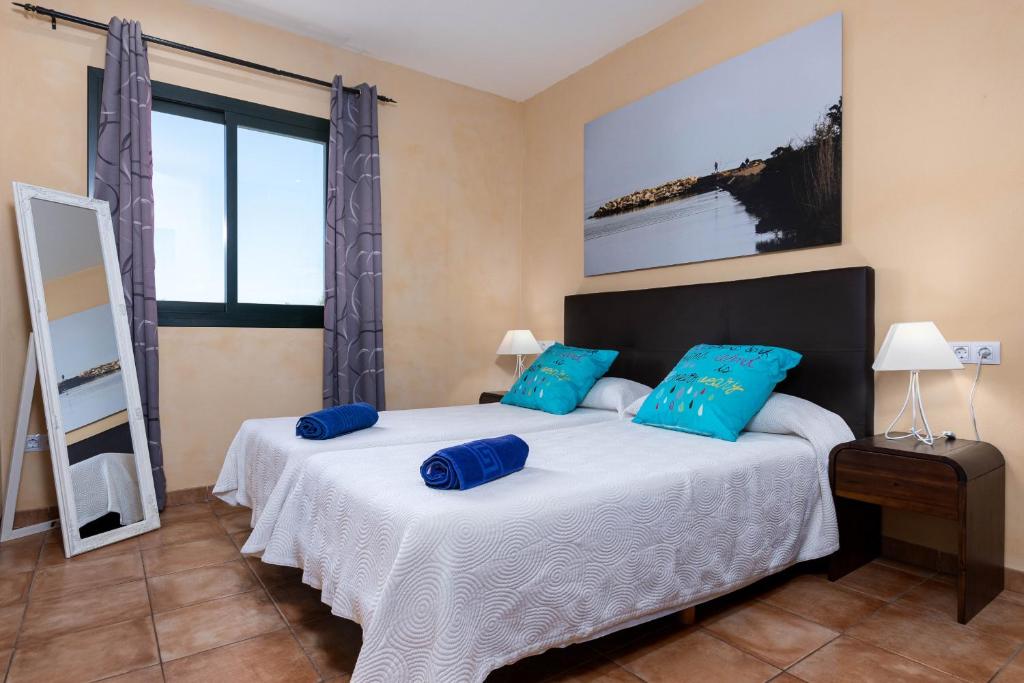 Postel nebo postele na pokoji v ubytování YourHouse Romani Villa