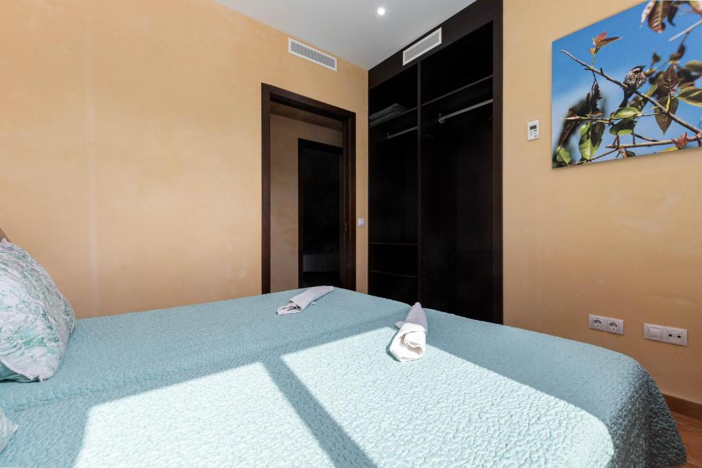 Postel nebo postele na pokoji v ubytování YourHouse Romani Villa