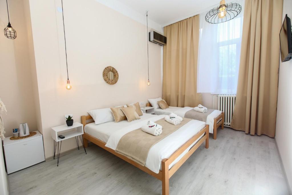 Postel nebo postele na pokoji v ubytování Vila LOLA