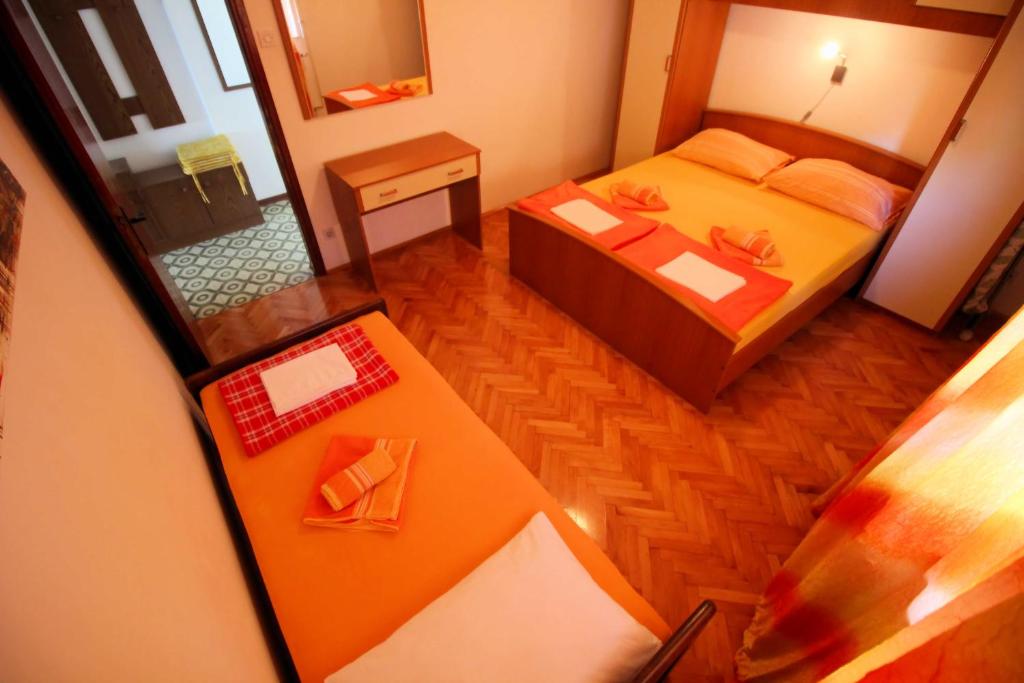 Postel nebo postele na pokoji v ubytování Apartmens Adriana