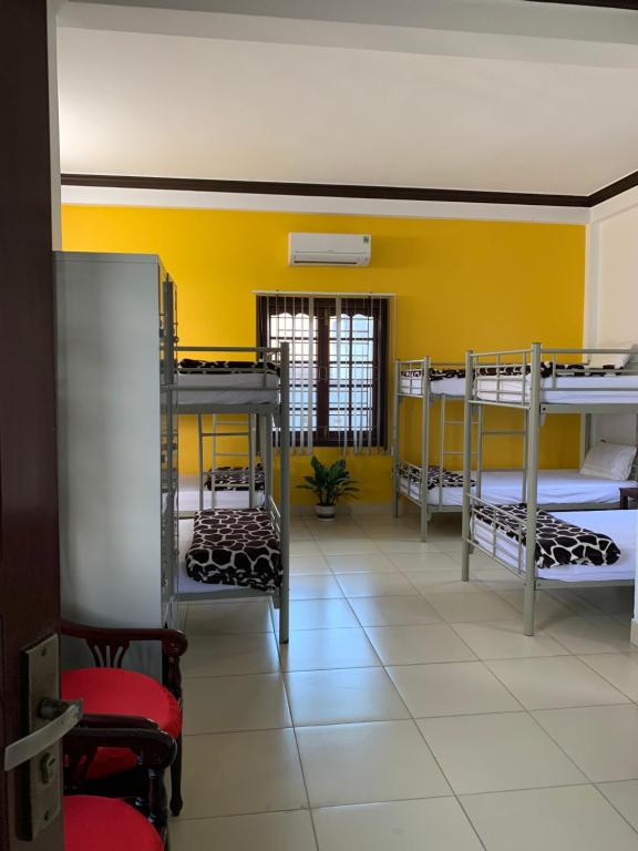 Postel nebo postele na pokoji v ubytování Cheerful Hoi An Hostel