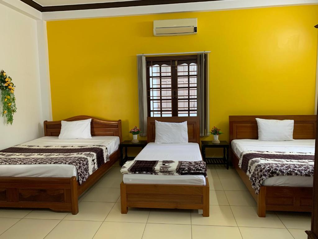 Postel nebo postele na pokoji v ubytování Cheerful Hoi An Hostel