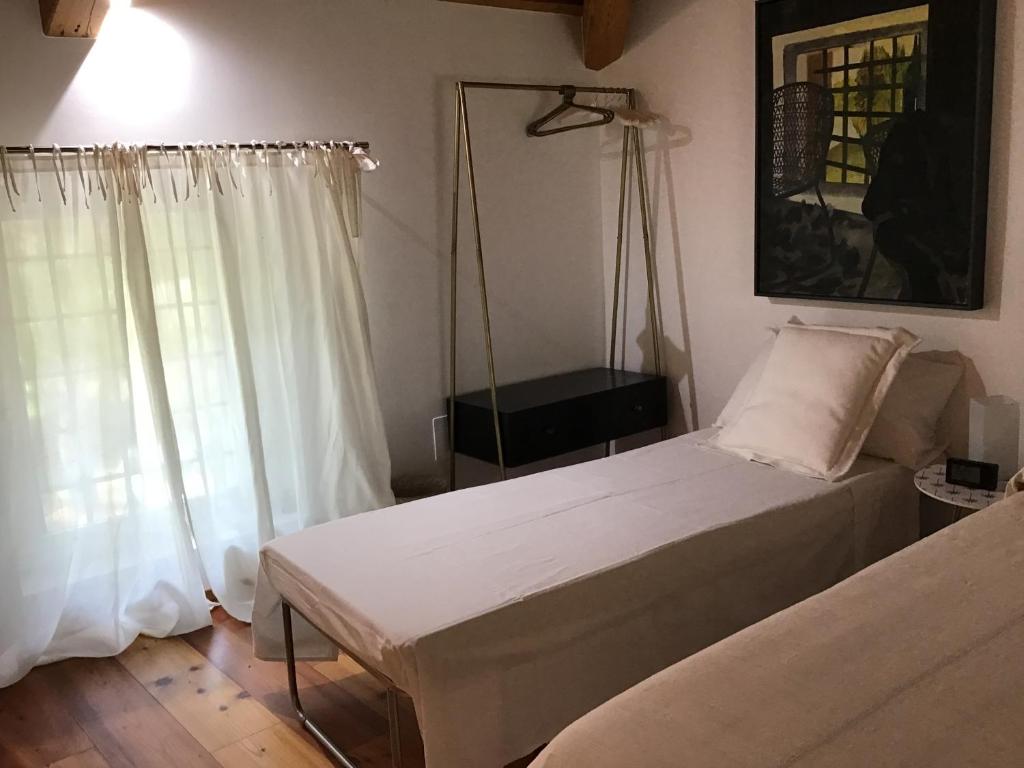 Posteľ alebo postele v izbe v ubytovaní La Foresteria di Villa Gorgo
