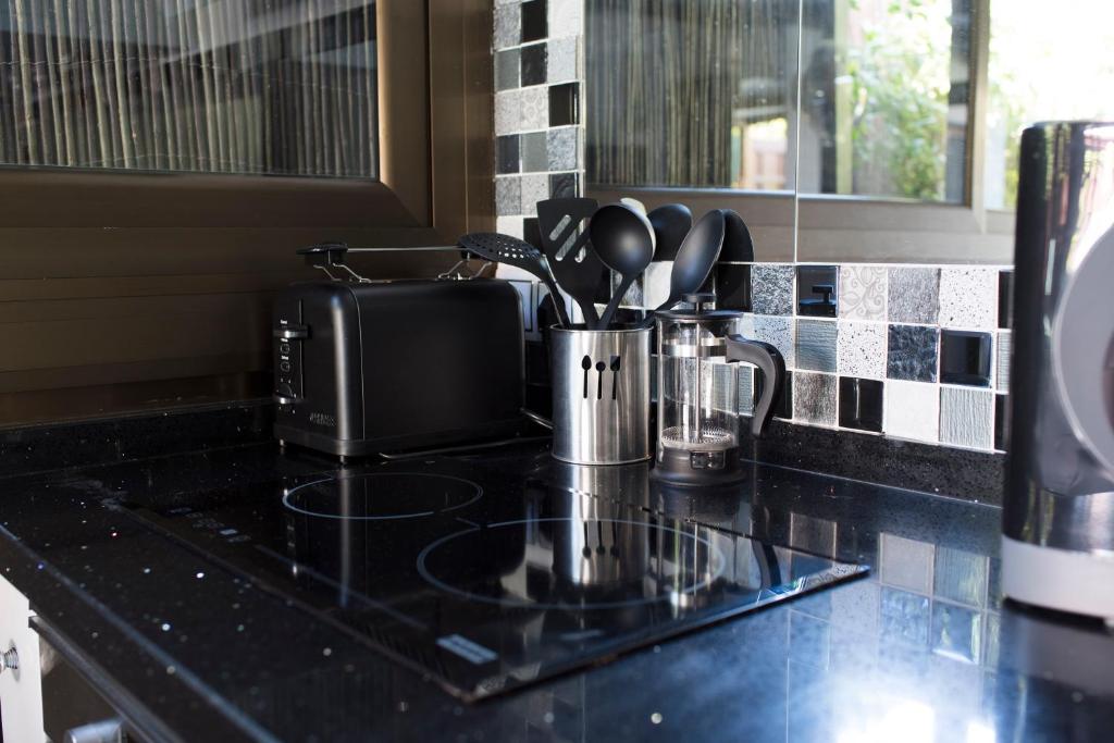 A kitchen or kitchenette at Bungalow Atos With Private Garden
