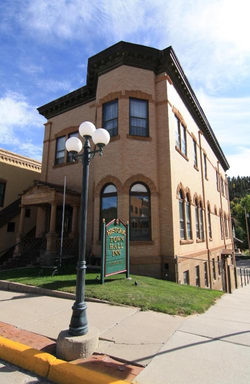 a building with a street light in front of it at Town Hall Inn in Lead