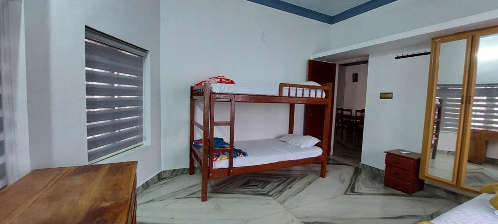 Postel nebo postele na pokoji v ubytování Jinan palace guest house Jinan palace guest house