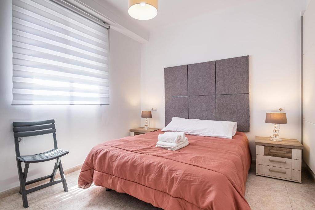 A bed or beds in a room at Apartamento Tugar D-1-3