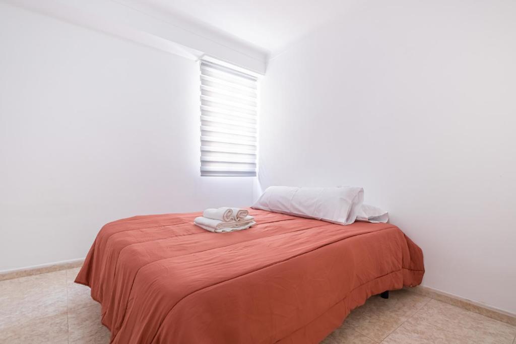 A bed or beds in a room at Apartamento Tugar D-1-3