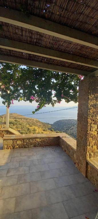a patio with a view of the mountains and trees at Holiday Home in Sfendouri, Aegina in Sfendoúrion