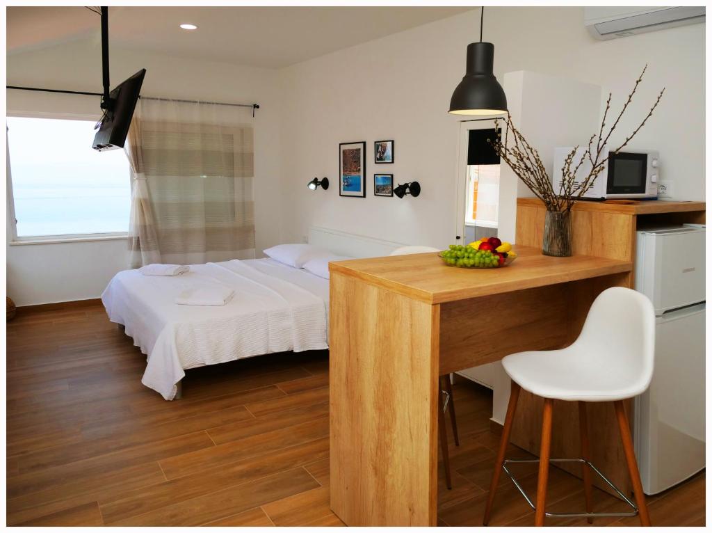 Postel nebo postele na pokoji v ubytování Apartmani Makelja