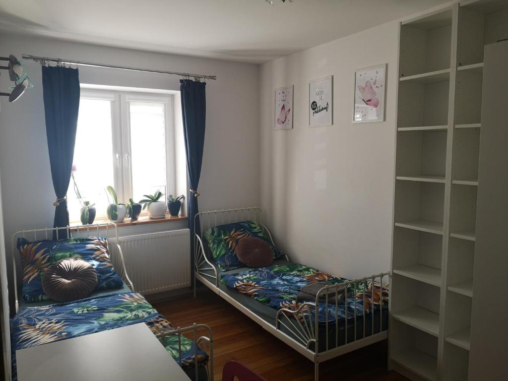 Posteľ alebo postele v izbe v ubytovaní YesPlease Giżycko Mazury