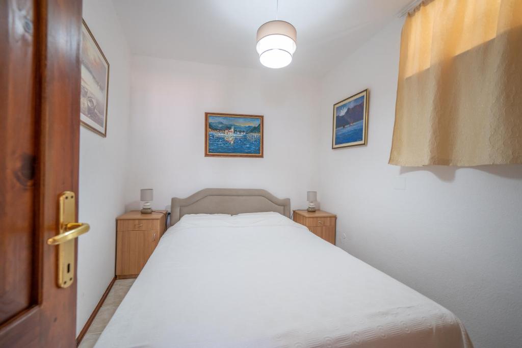 Llit o llits en una habitació de Apartments Franovic