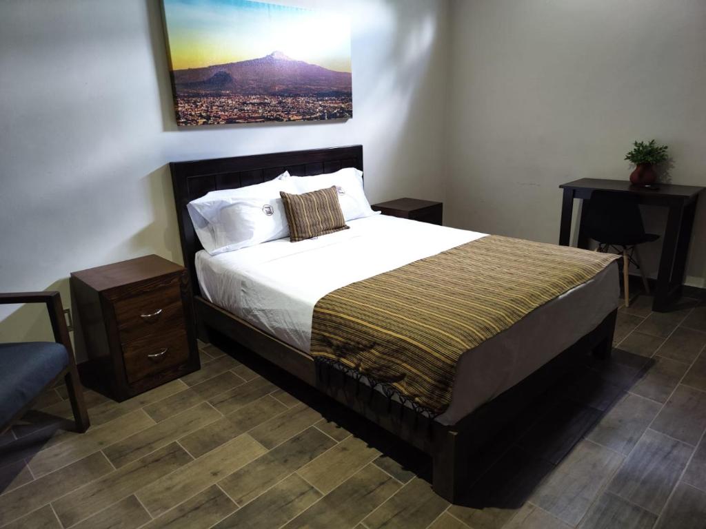 A bed or beds in a room at Hostería Tocali