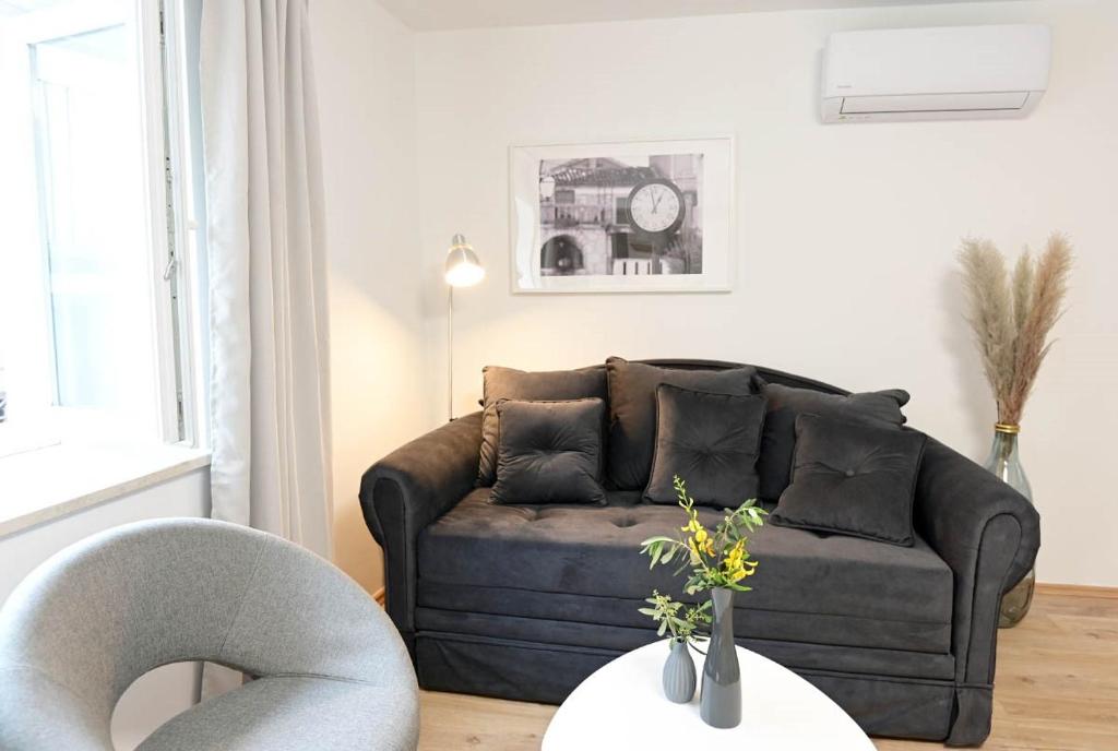 Posezení v ubytování Apartment D & Studio L