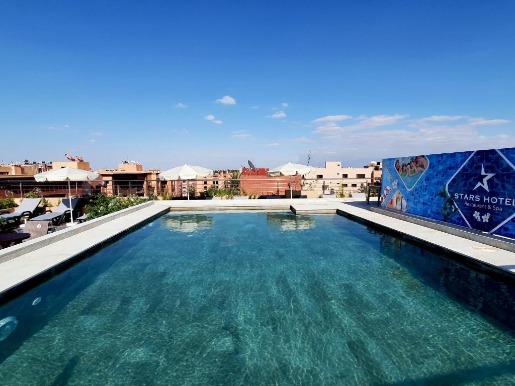 a swimming pool on the roof of a building at Stars Hotel & Spa in Marrakech