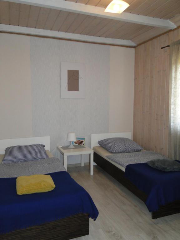 Postel nebo postele na pokoji v ubytování Domki Zielona Osada