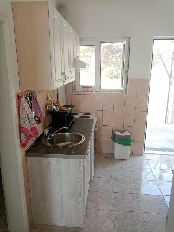 Kuchyň nebo kuchyňský kout v ubytování Apartmani Bosco