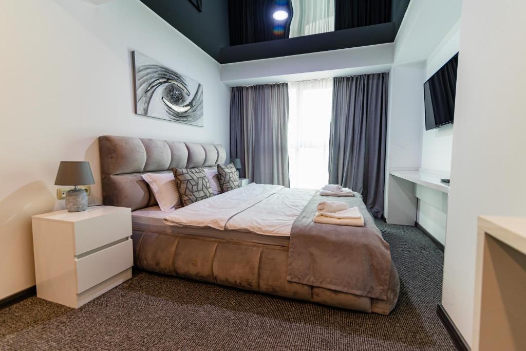 Postel nebo postele na pokoji v ubytování Royal Plaza Hotel