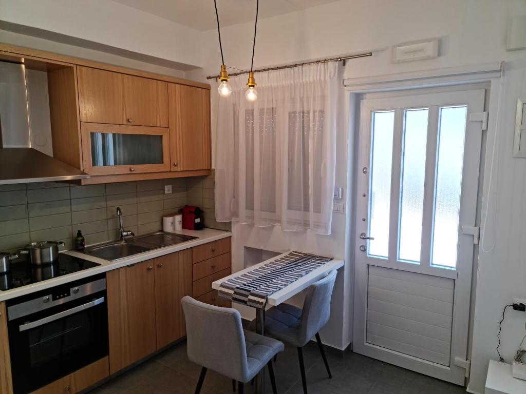 a kitchen with a table with a keyboard on it at Hera gk apts in Chania Town