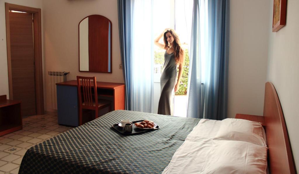 Postel nebo postele na pokoji v ubytování Hotel Costa Citara