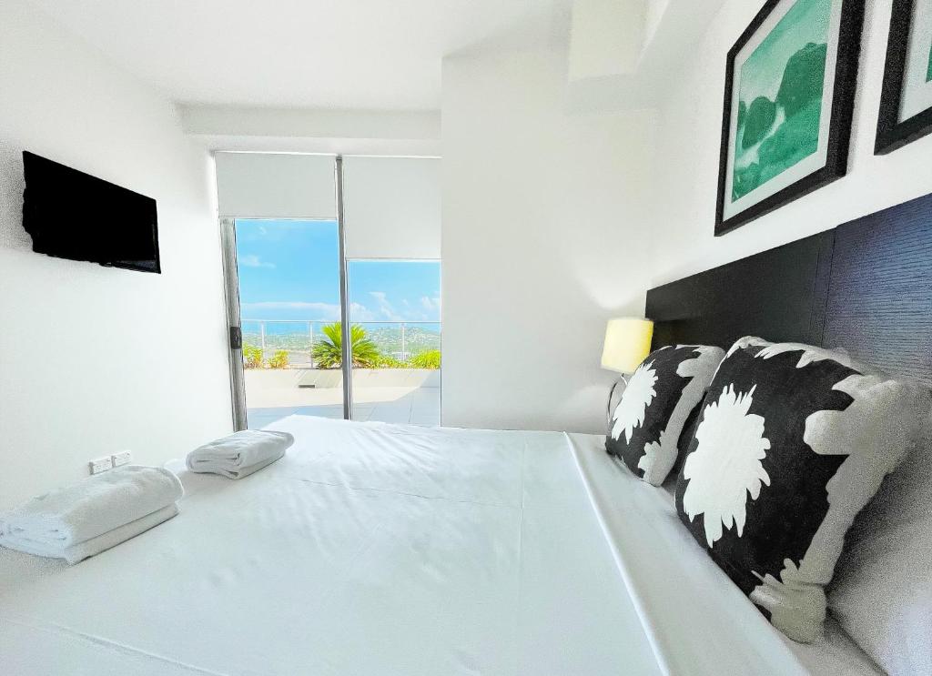 Postel nebo postele na pokoji v ubytování Oshen Holiday Apartments Yeppoon