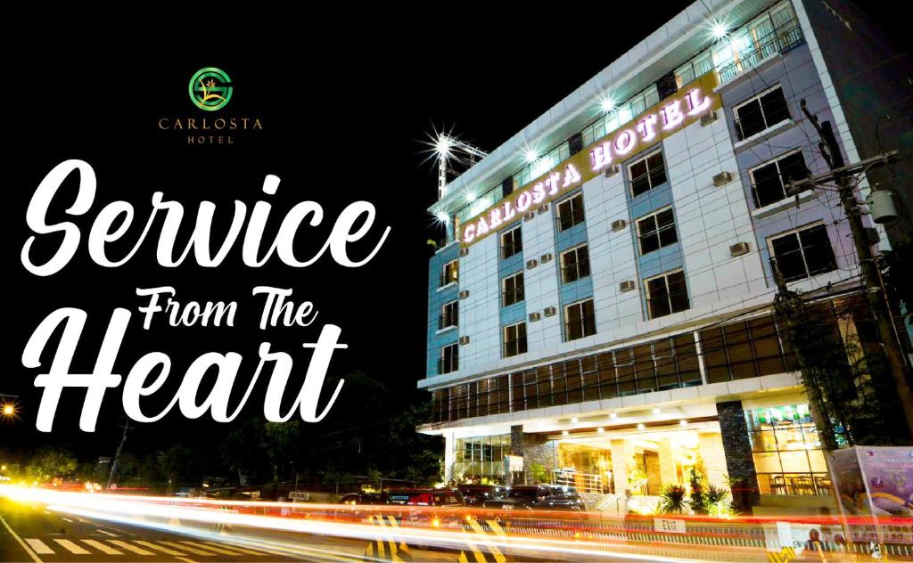 a picture of a hotel with the words service from the heart at Carlosta Hotel in Ormoc