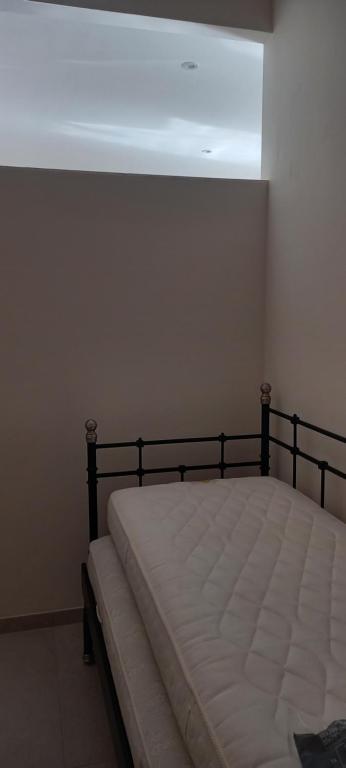 Łóżko lub łóżka w pokoju w obiekcie Casa Elisabetta