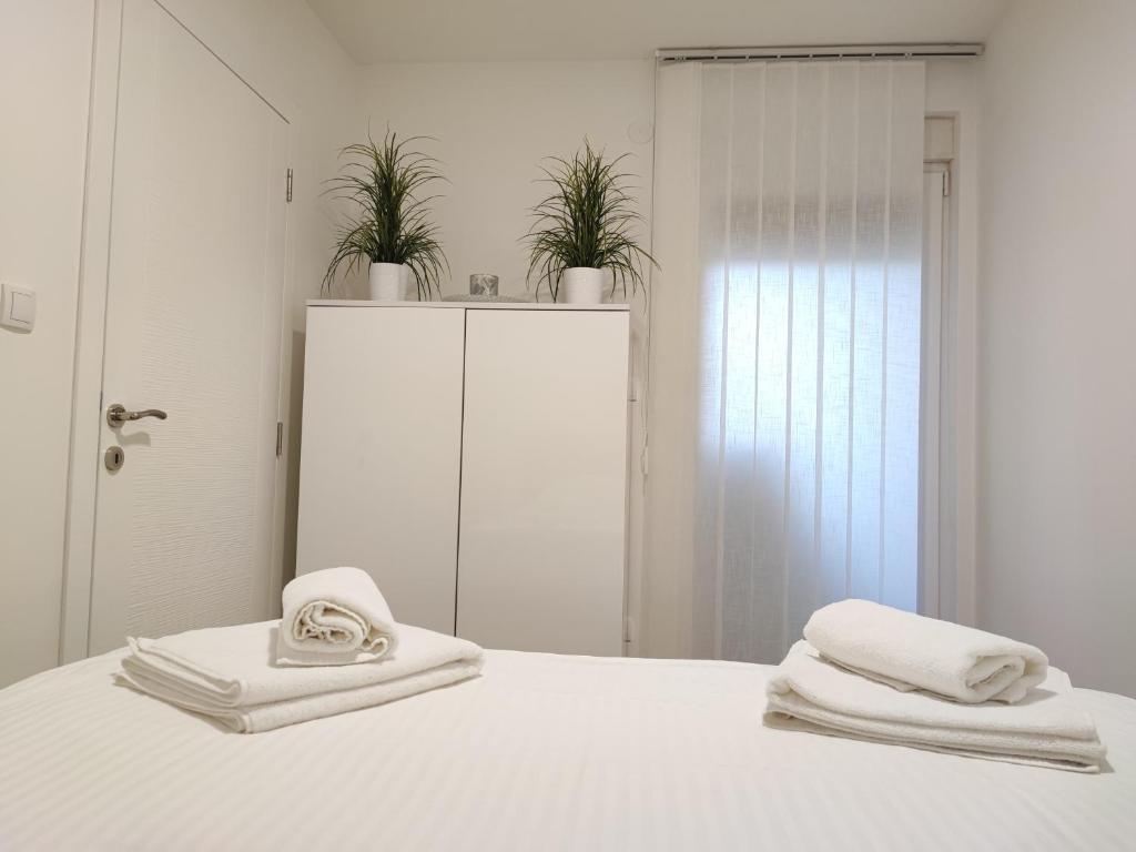 Postel nebo postele na pokoji v ubytování Spa Koncept-Apartmani
