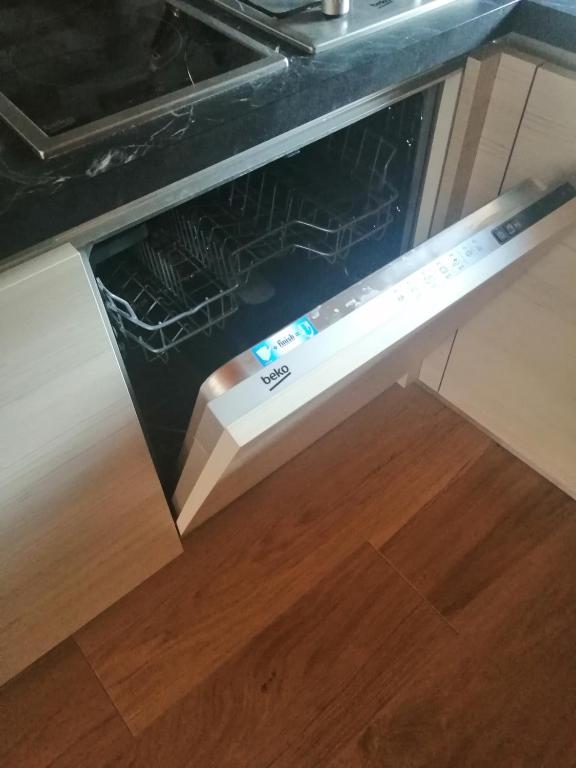 Kuchyň nebo kuchyňský kout v ubytování Cadore Luminoso appartamento