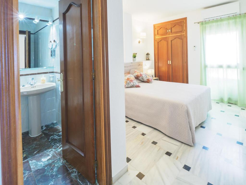 Postel nebo postele na pokoji v ubytování Cubo's Apartamento Oceanview Lubina