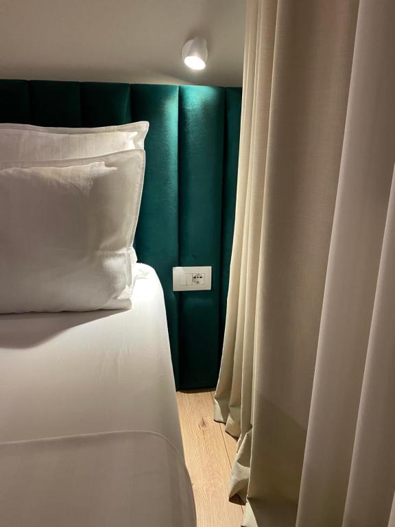 Postel nebo postele na pokoji v ubytování Living Studio Apartments