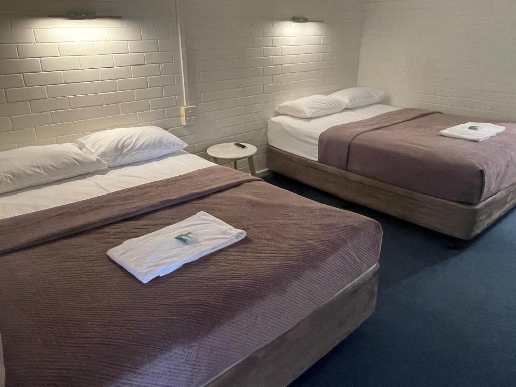 Postel nebo postele na pokoji v ubytování Bananatown Motel