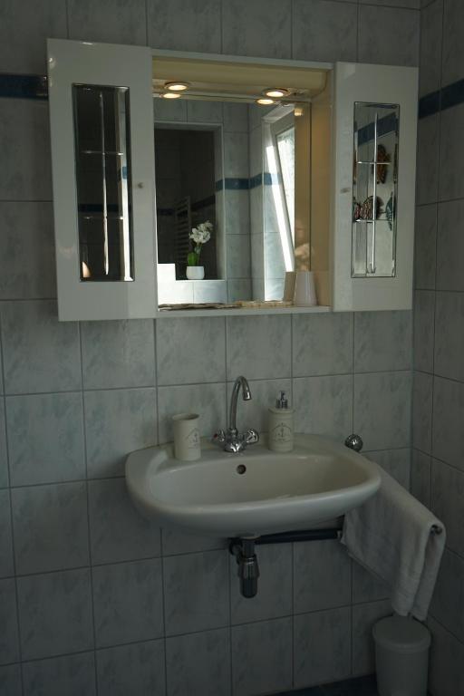 a bathroom with a sink and a mirror at Landhaus im Hartbergerland in Hartberg