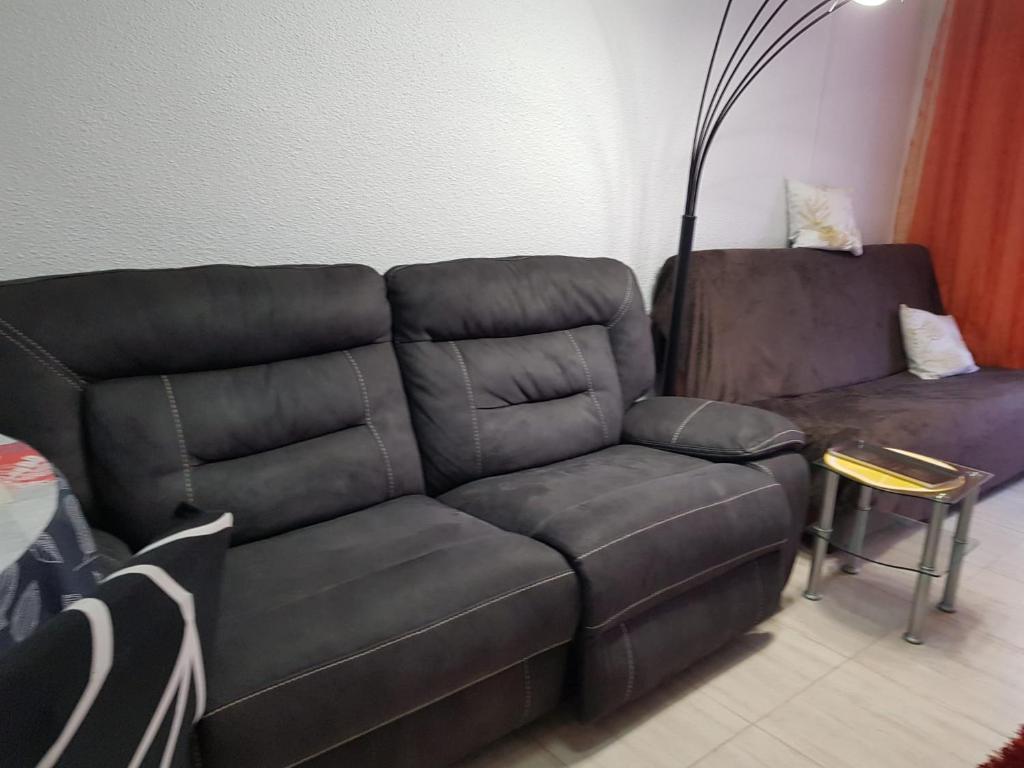 A seating area at Apartalux Brizo Suites