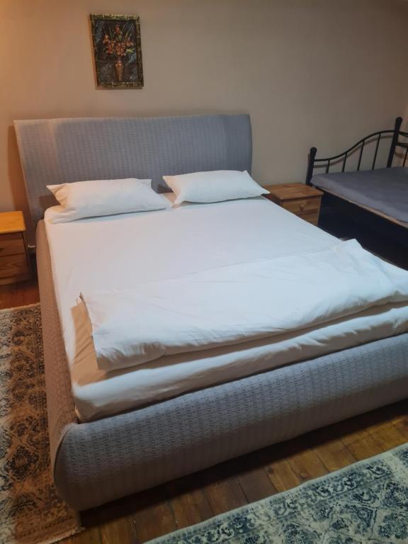 Postel nebo postele na pokoji v ubytování Pensiunea Clasic