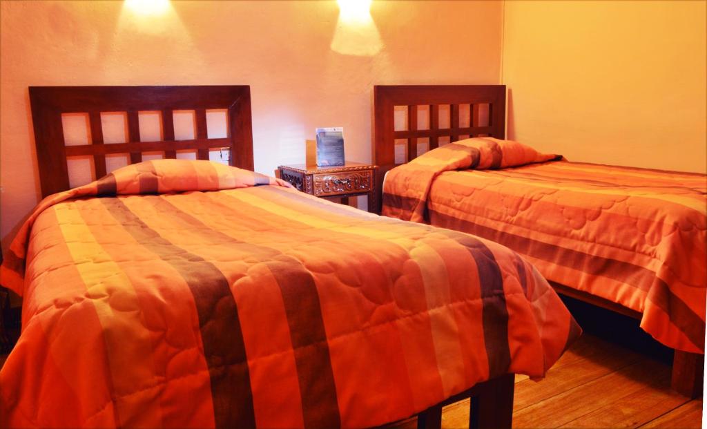 Postel nebo postele na pokoji v ubytování Hosteria de Anita