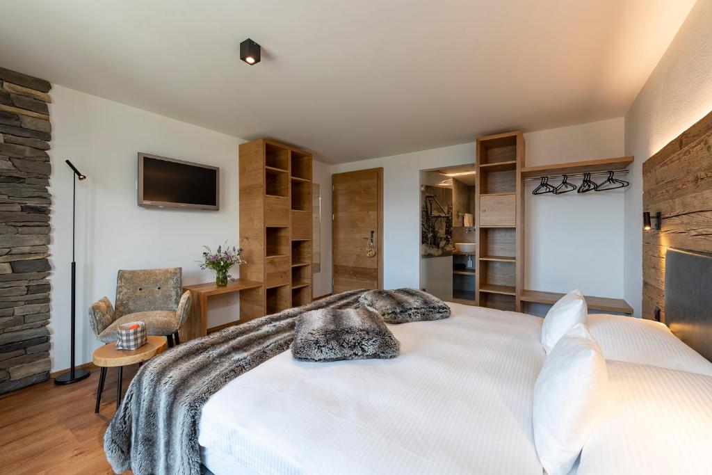 Postel nebo postele na pokoji v ubytování Berghotel Tgantieni