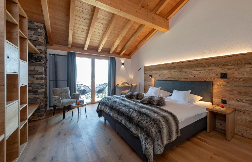 Postel nebo postele na pokoji v ubytování Berghotel Tgantieni
