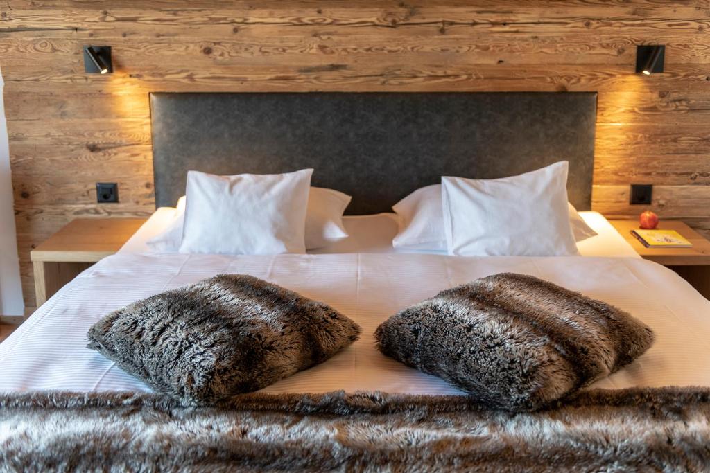 Postel nebo postele na pokoji v ubytování Berghotel Tgantieni