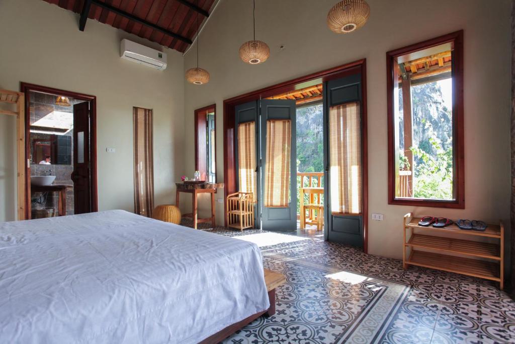 Giường trong phòng chung tại LittleTamCoc Boutique Villa Ninh Binh