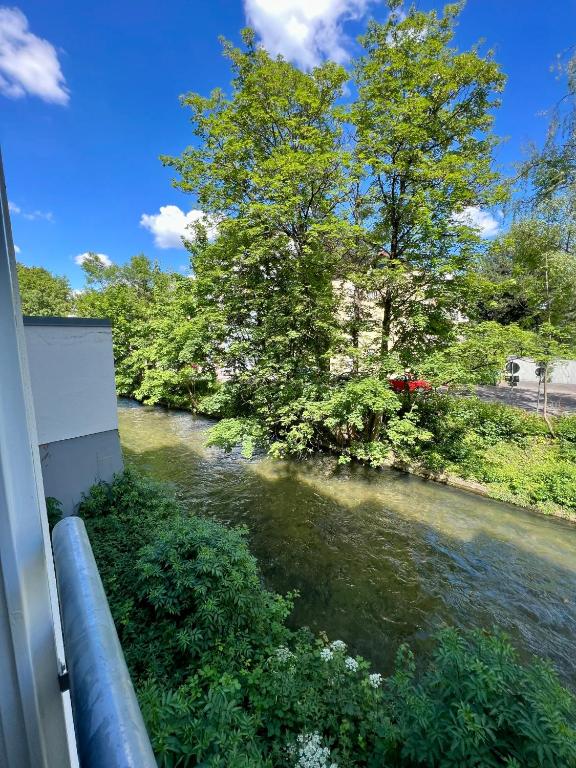 a view of a river from a window at Apartment am Stadtbach by Aux Property in Augsburg
