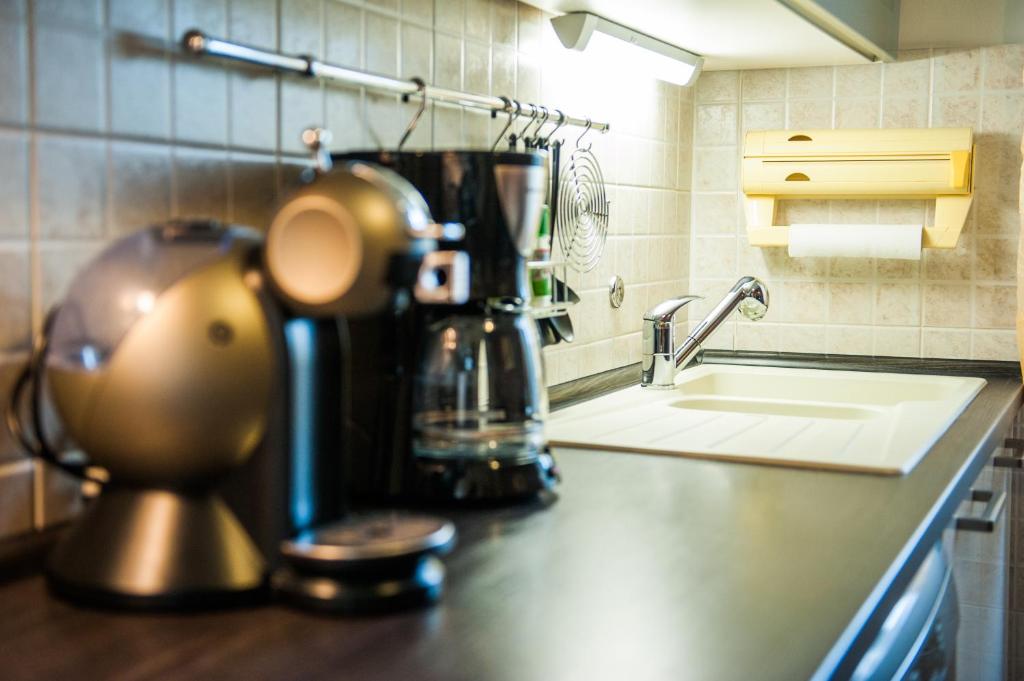 Kuchyň nebo kuchyňský kout v ubytování Downtown Apartment Nora