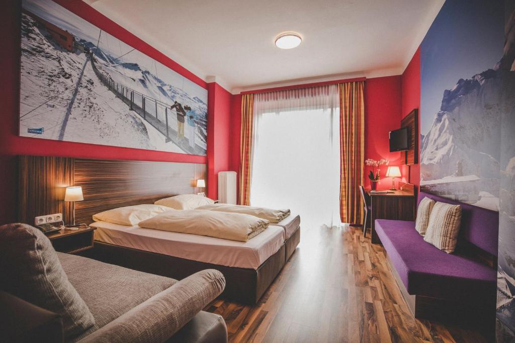 Postel nebo postele na pokoji v ubytování Kurhotel & Hotel Mozart