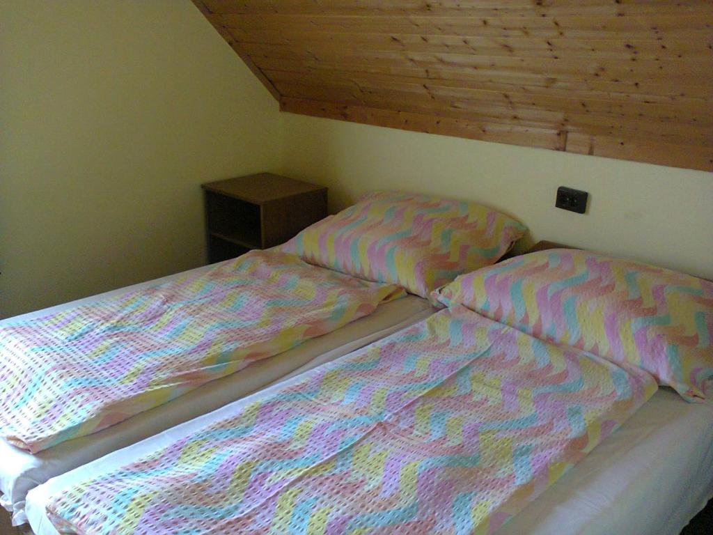A bed or beds in a room at F 106 Vendégház