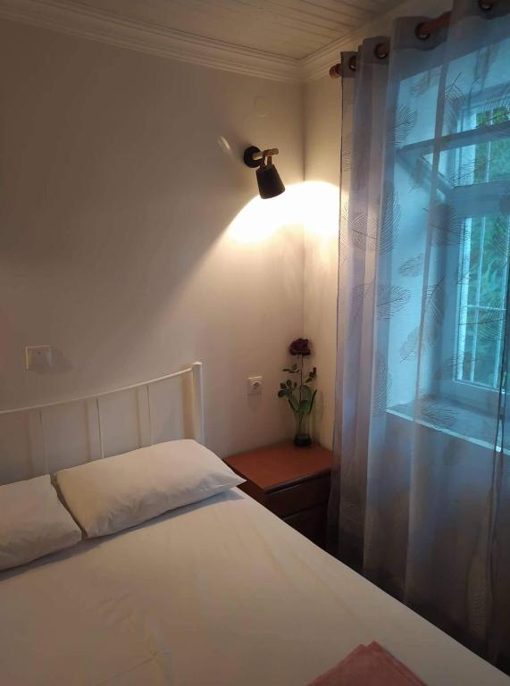 Postel nebo postele na pokoji v ubytování Vasilis traditional House