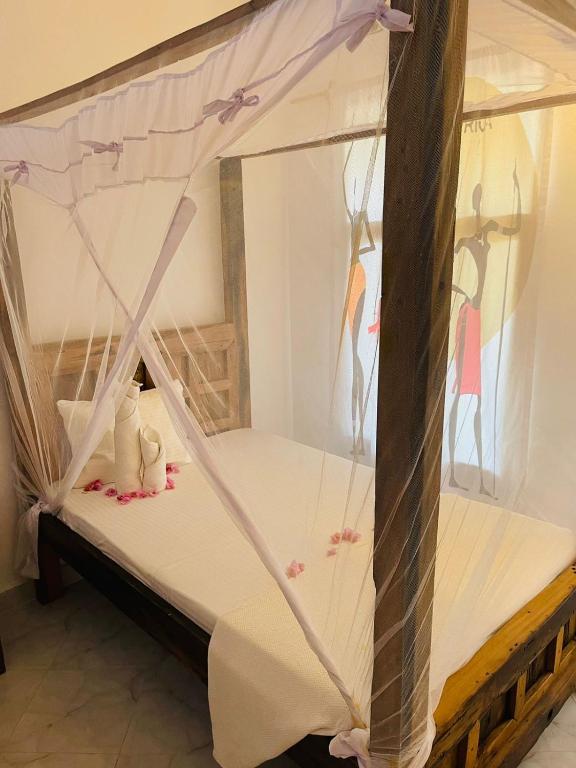 Voodi või voodid majutusasutuse Babalao Bungalows toas