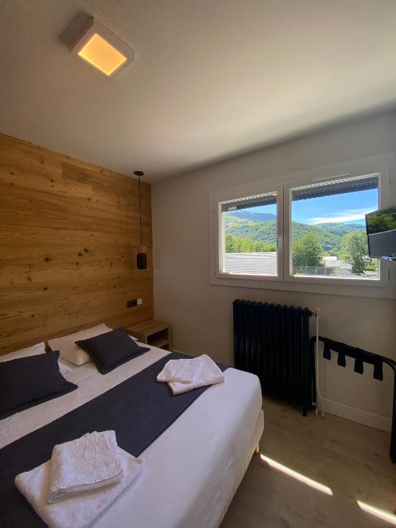 Postel nebo postele na pokoji v ubytování Hotel Le Chalet