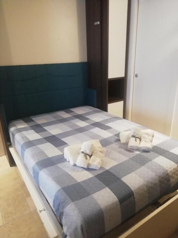 A bed or beds in a room at Le Antiche Travi